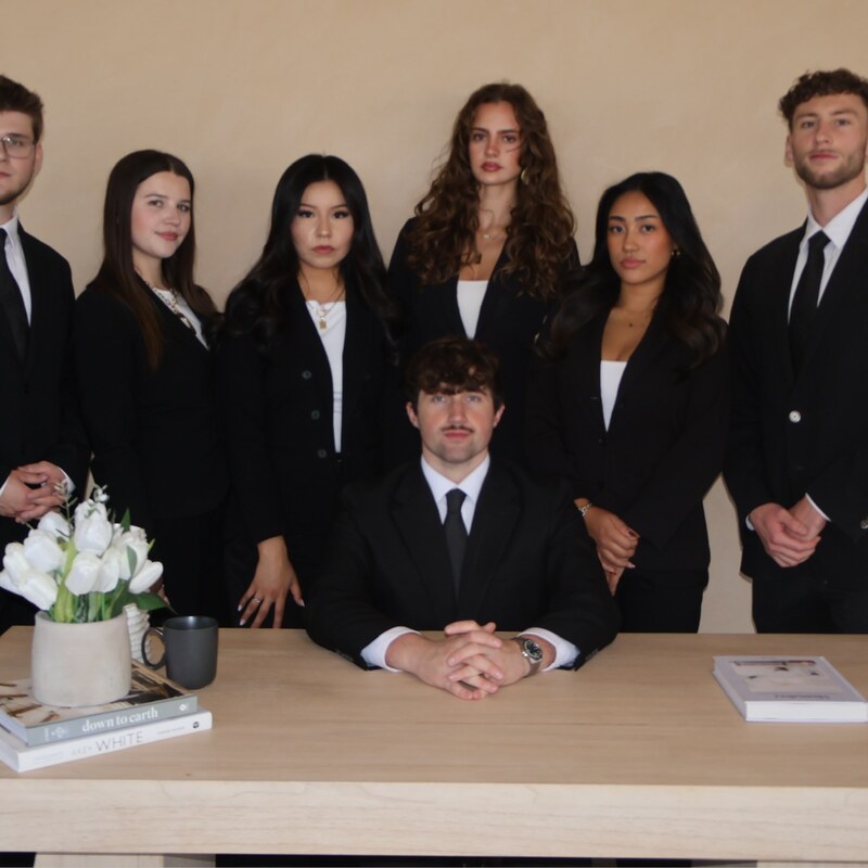 The Edge Marketing Agency team in business attire at the office