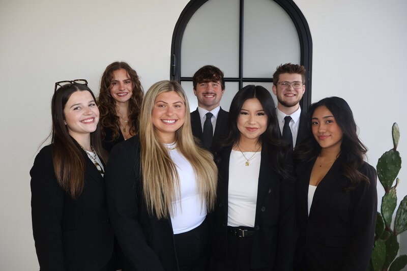 Eight Edge Marketing Agency team members standing together in professional attire
